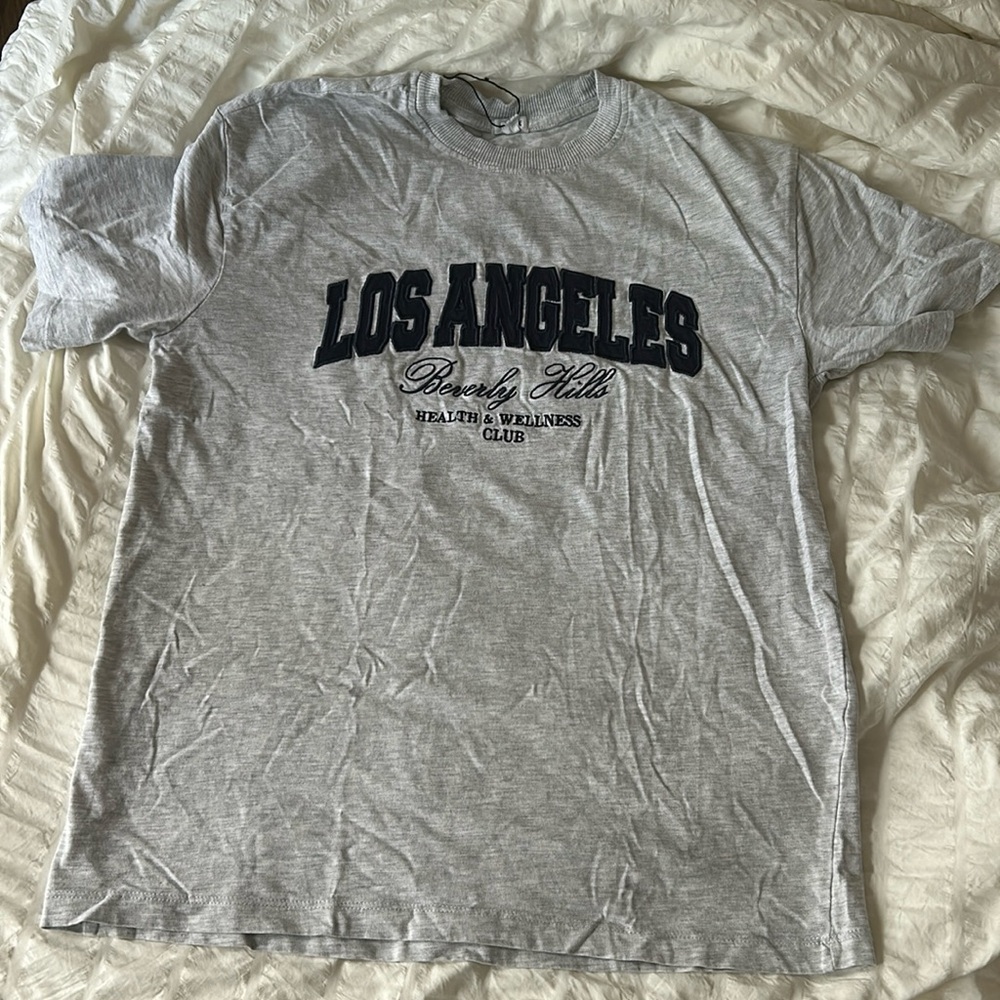 this shirt is from garage, and the size is TP / XS